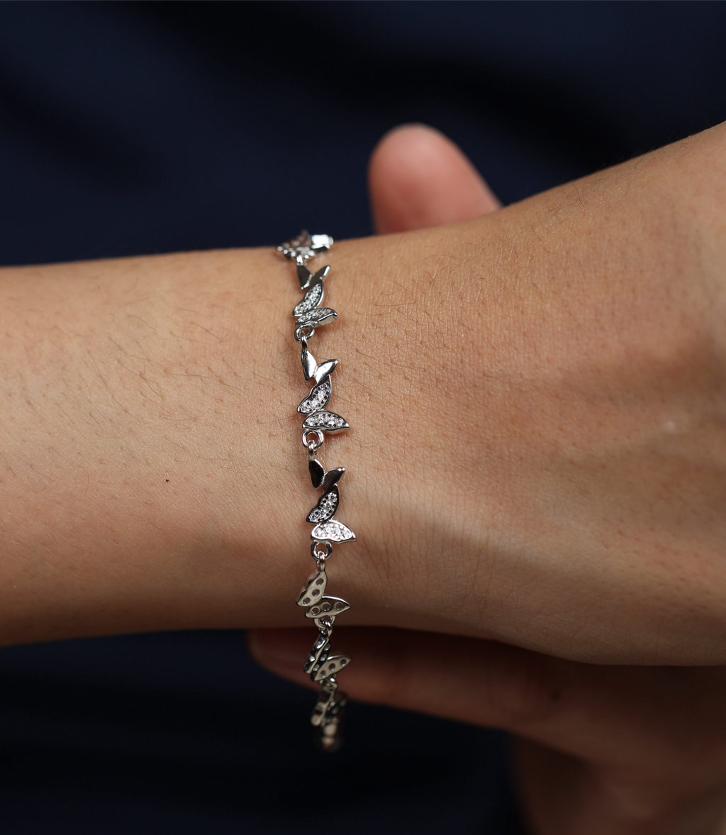 925 silver butterfly bracelet worn on wrist with detailed butterfly charm elements