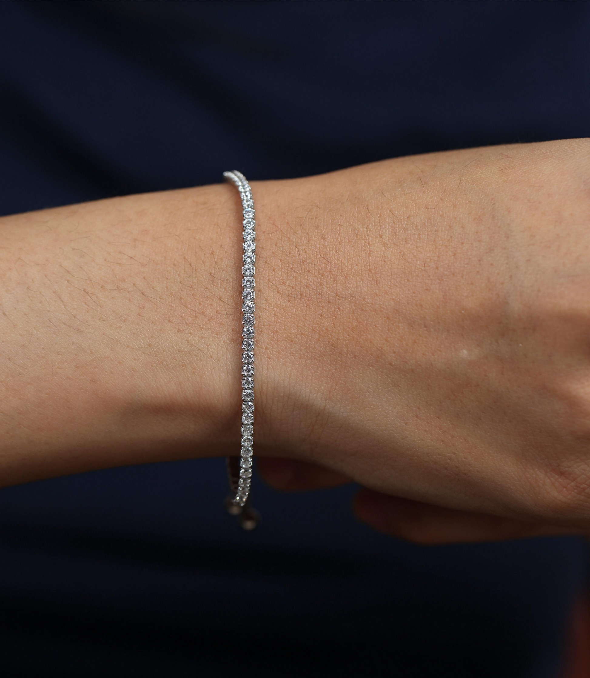 925 silver bracelet with cubic zirconia stones worn by woman