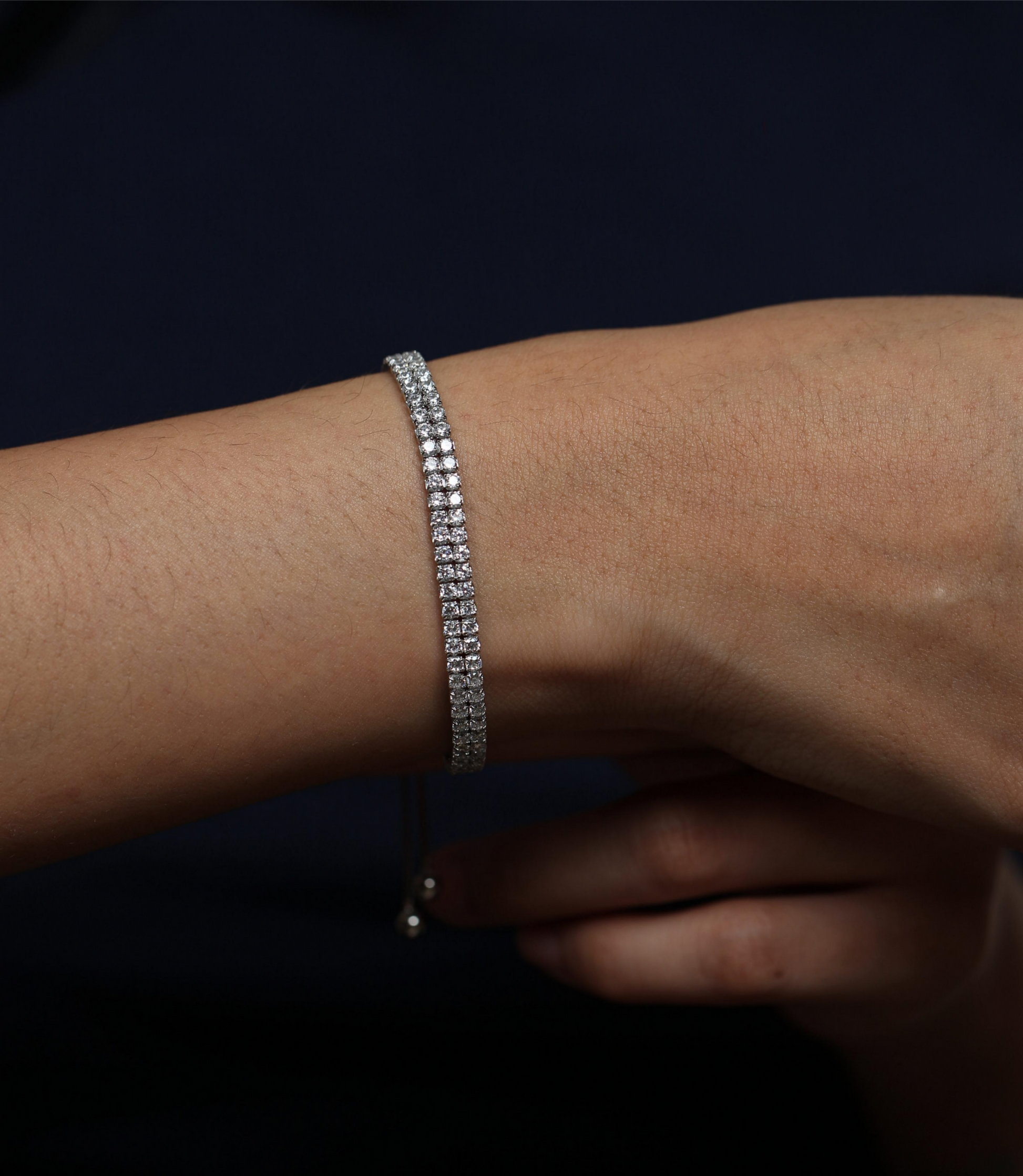 925 silver bracelet with dual stone rows worn by woman