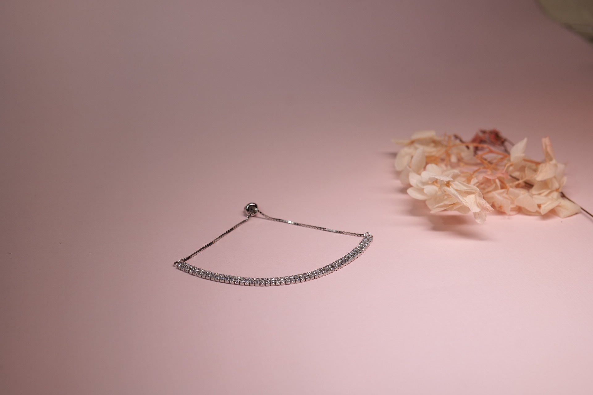 Sterling silver adjustable bracelet with stones, suitable for gifting