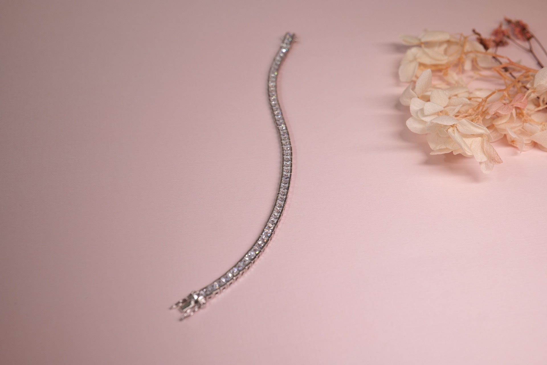 925 silver tennis bracelet featuring square-cut stones in a sleek linear design
