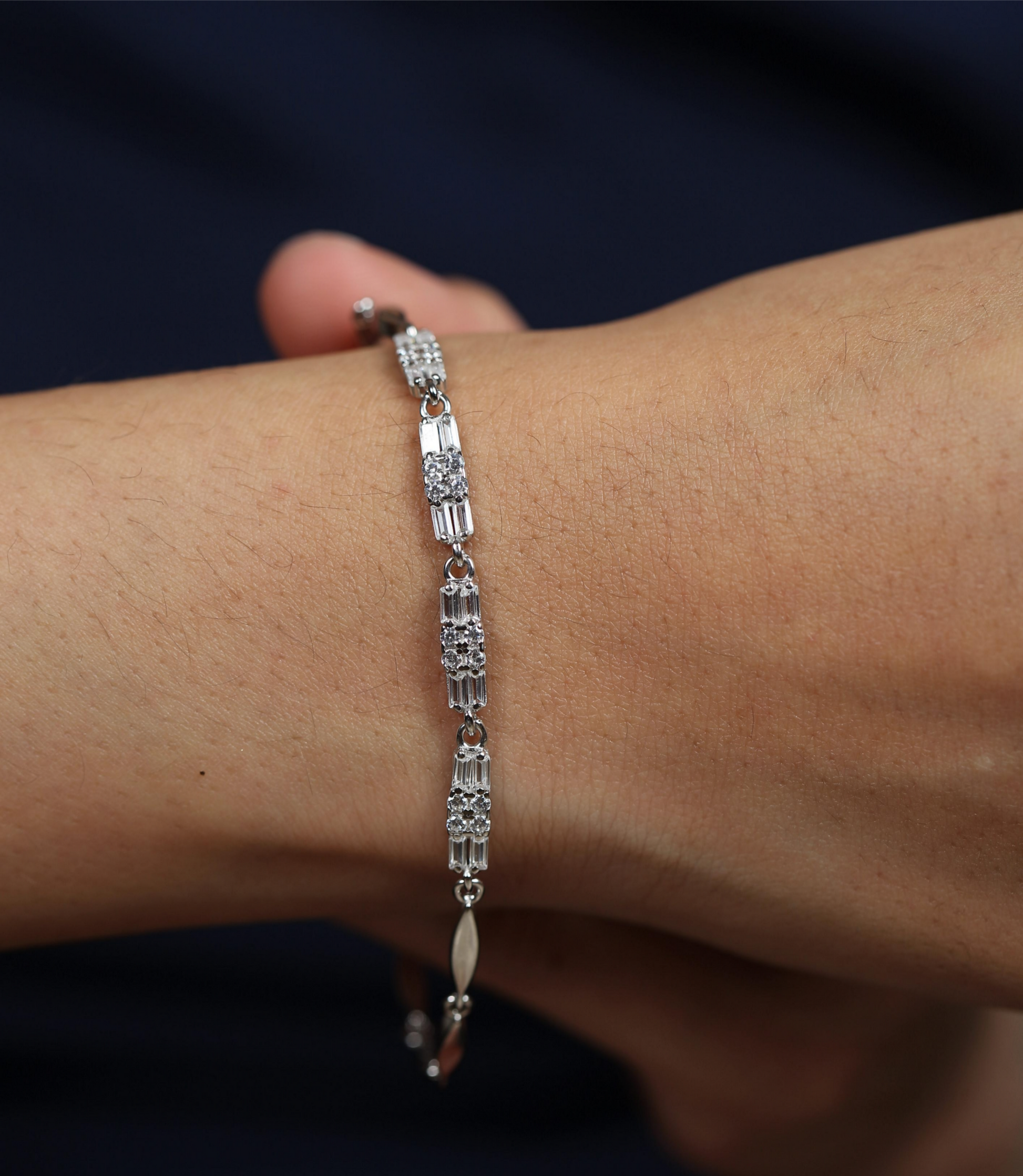 925 silver link bracelet worn on wrist with sleek textured and polished segments